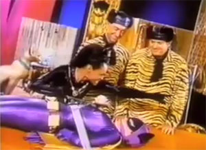 Batgirl tied up by Catwoman