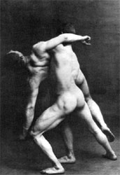Naked men wrestling.